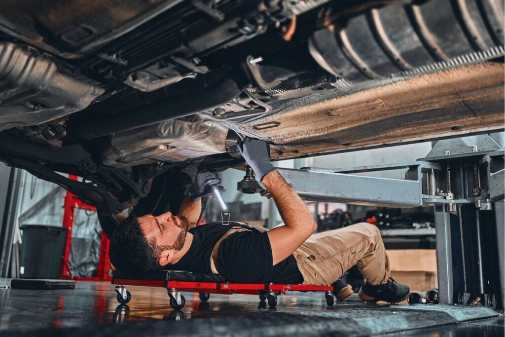 A professional mechanic working on a client's car near Lane Allen Road in West Lexington, KY