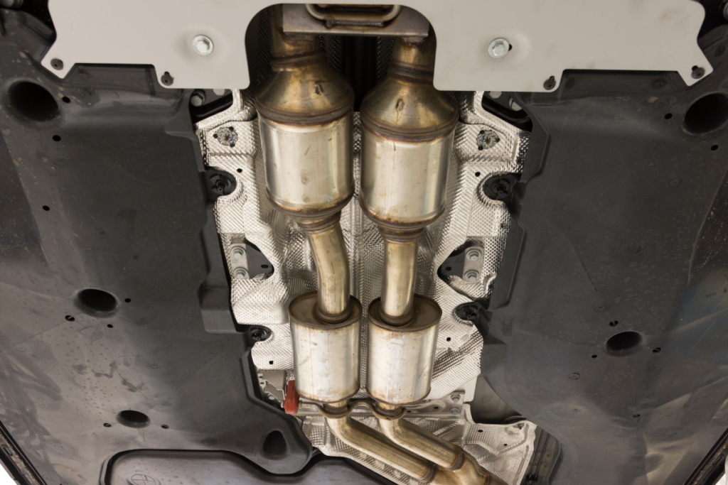 An image of a modern car's catalytic converter on the underside of the vehicle